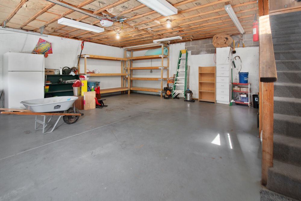 A garage with a bare concrete floor